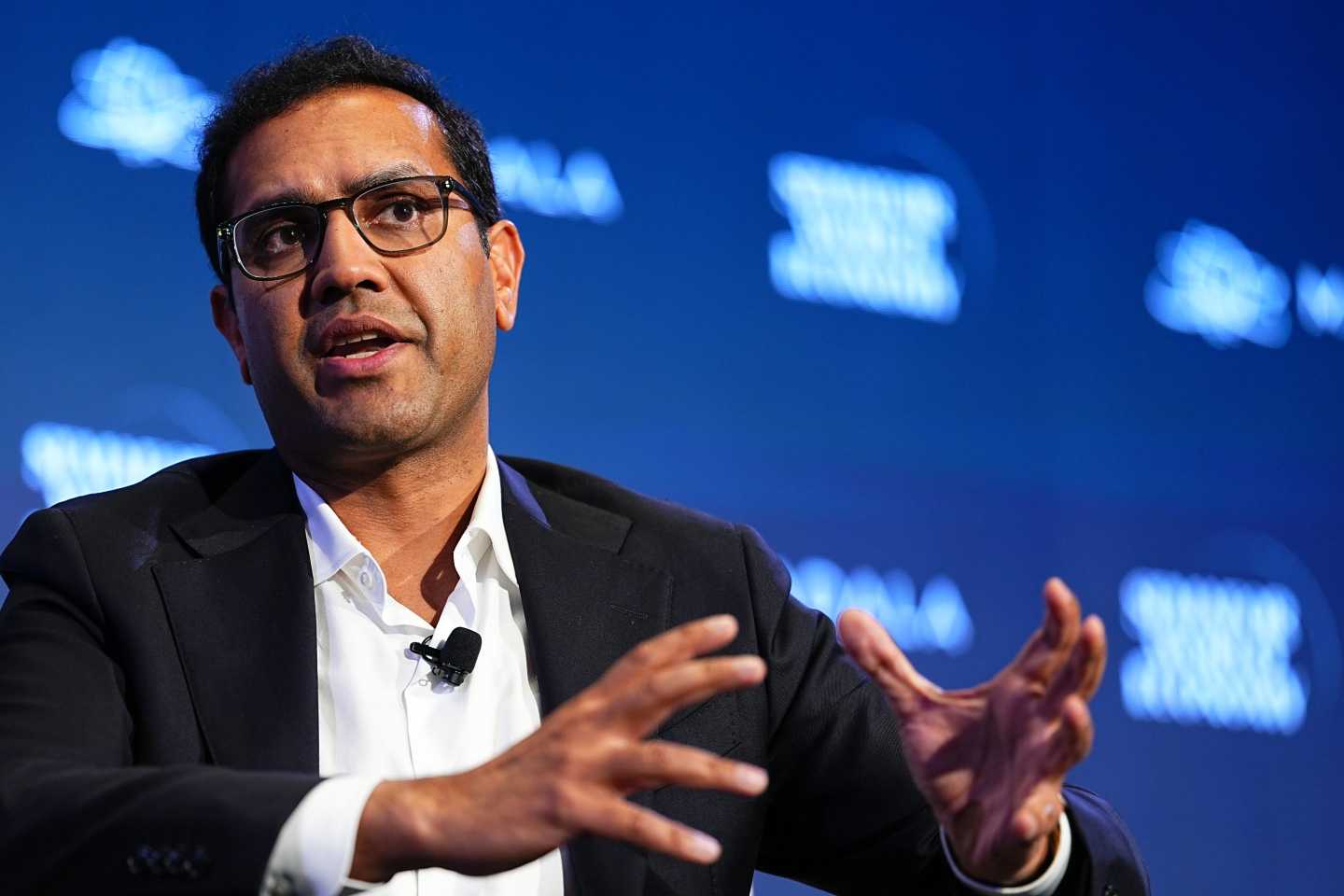 Man in a suit and glasses