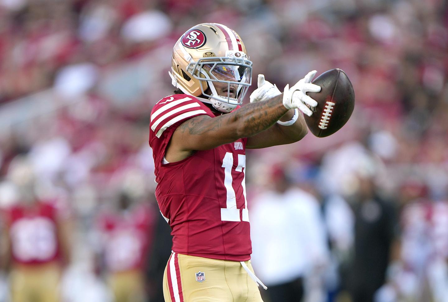 Jordan Watkins #17 of the San Francisco 49ers signals first down after catching a pass against the Tennessee Titans in the first half at Levi's Stadium.