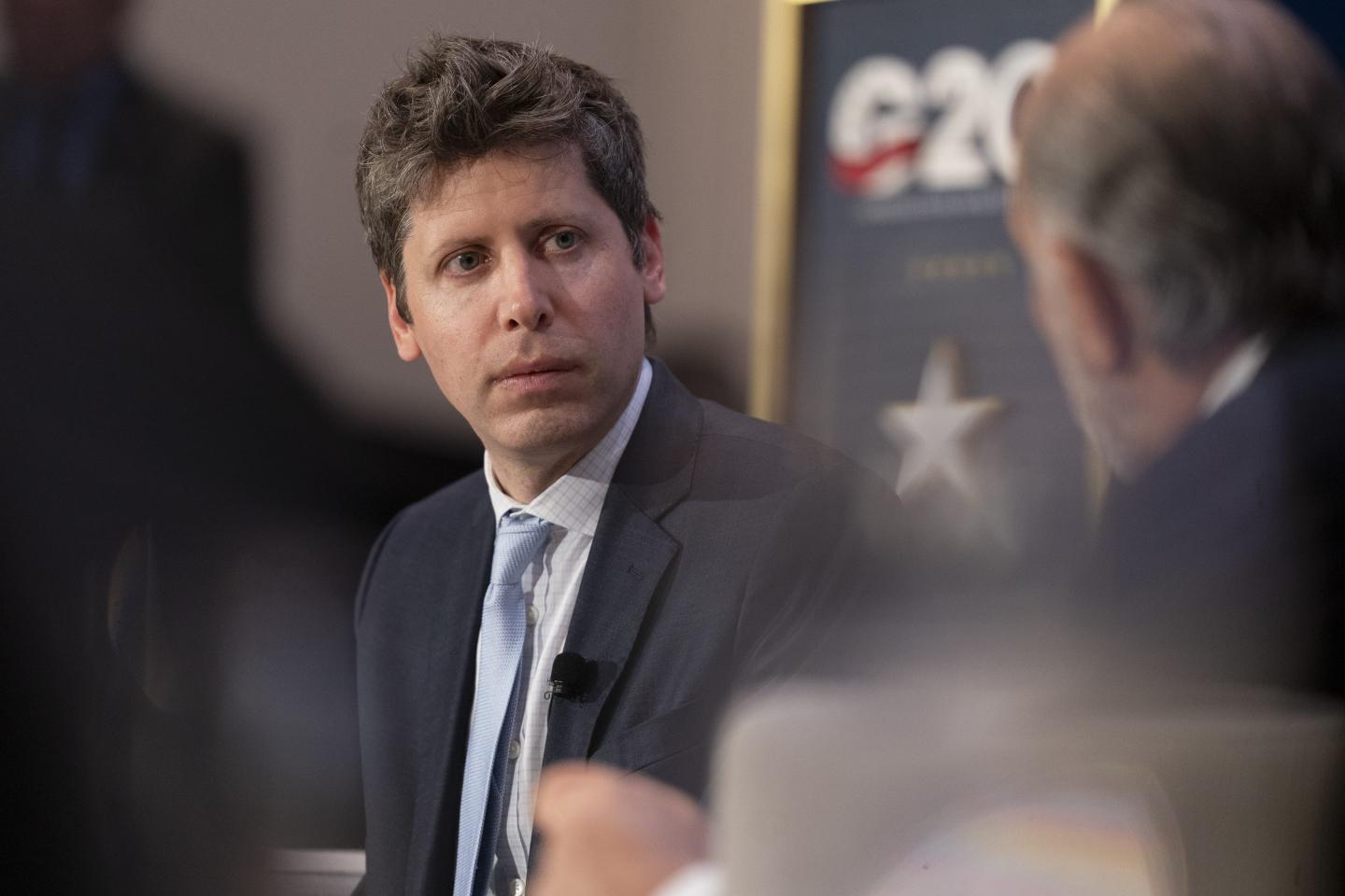 Photo of OpenAI CEO Sam Altman speaking at a G20 meeting.