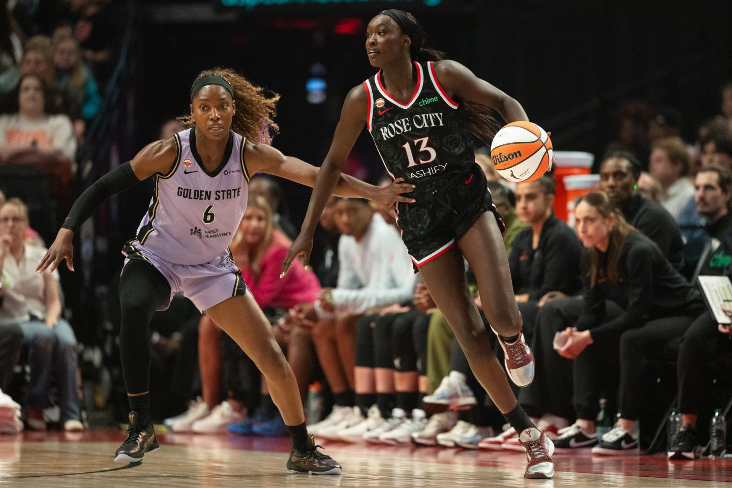 Nyadiew Puoch dribbles around Kaila Charles.