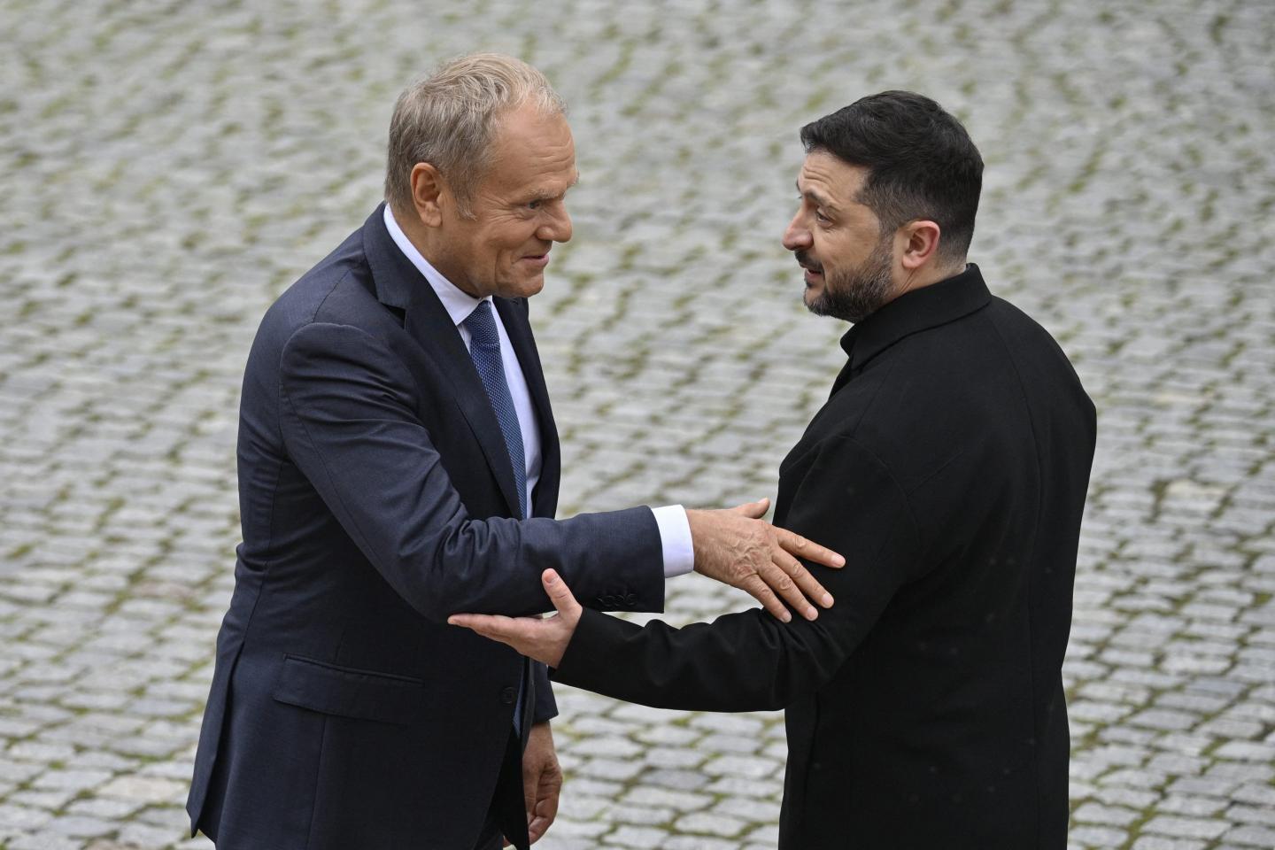 President of Ukraine Volodymyr Zelensky (R) welcomes Prime Minister of Poland Donald Tusk (L) as he arrived to attend the Carpathian 8 summit in state residence in Ivano-Frankivsk region on September 18, 2026.