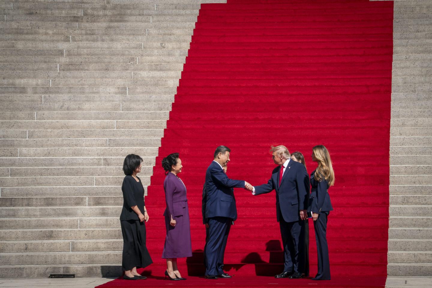 President Donald Trump and first lady Melania Trump pose for a photo with Chinese President Xi Jinping and his wife Peng Liyuan walk down the steps of the National Archives during President Xi Jinping's state visit, Sept. 25 2026, in Washington, DC. 