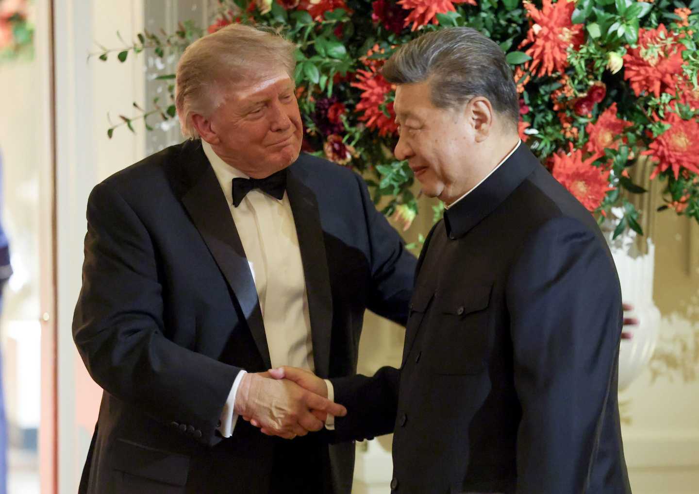Photo of Trump and Xi shaking hands