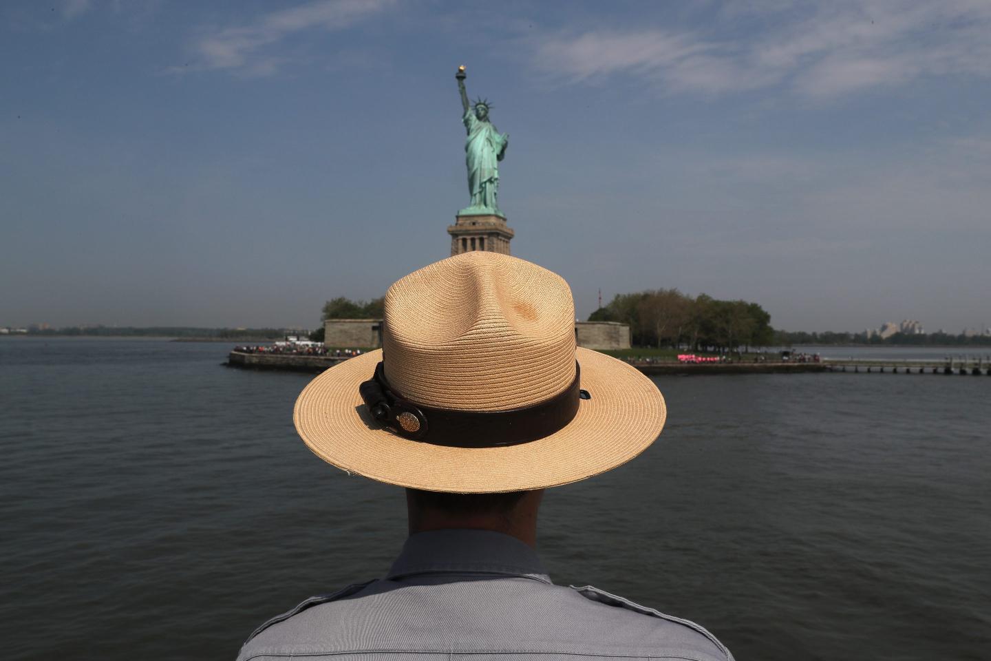The Statue of Liberty is facing the New York Harbor to welcome anyone coming to the country for the first time.