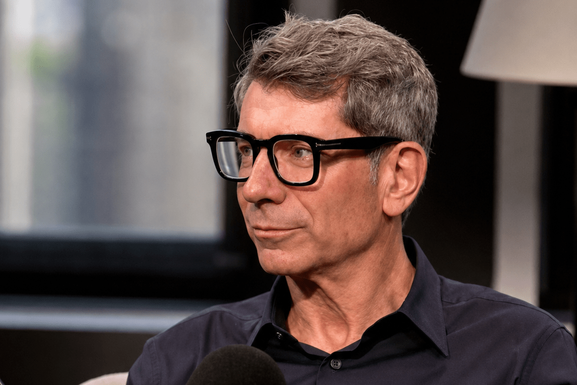 Peter Levin, co-founder of Griffin Gaming Partners, sits in front of a microphone.
