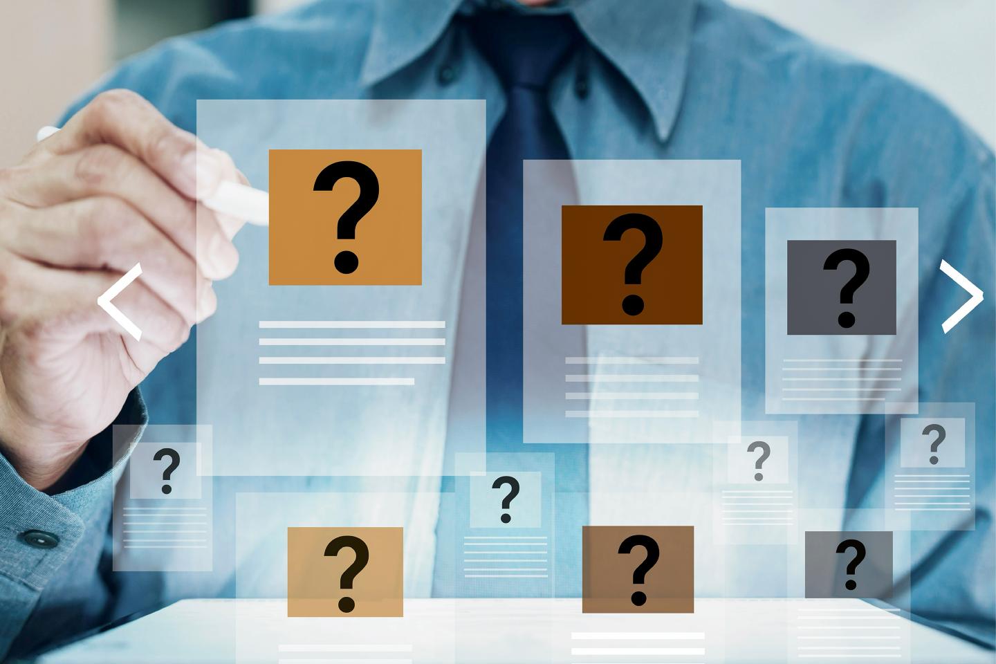 A person working on a panel with a question mark.