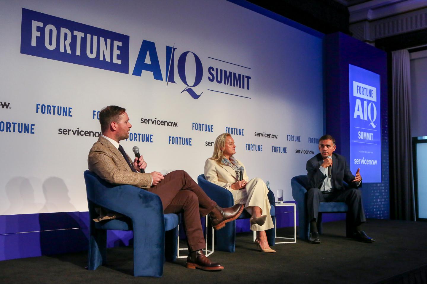 Fortune's Andrew Nusca; Sally Moore, chief client officer and co-head of market intelligence at S&P Global; and Hari Gopalkrishnan, chief technology and information officer for Bank of America at the Fortune AIQ Summit on Oct. 1, 2026 at the New York Stock Exchange.