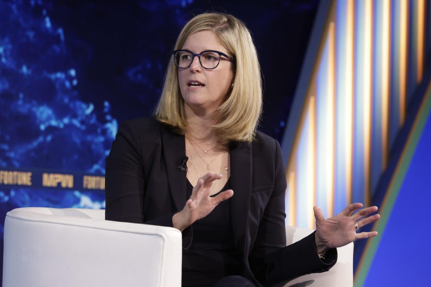 Woman in glasses gestures