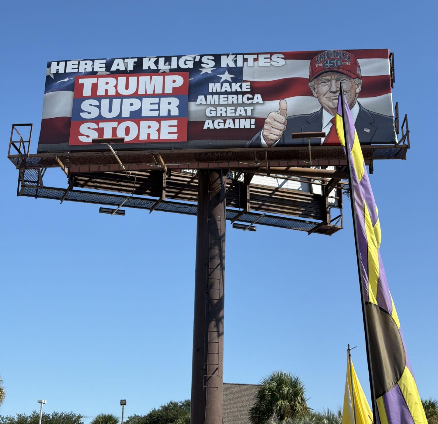 Photo of a billboard of Richard Kligman's Trump Super Store with an image of Trump on it