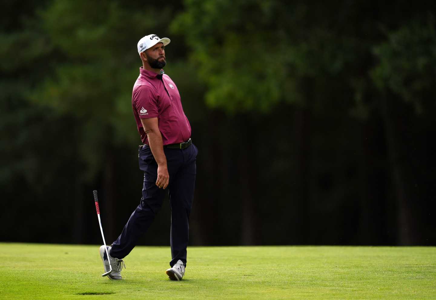 Jon Rahm of Spain drops his club on the 13th hole during the first round of the BMW Championship golf tournament in Virginia Water, England.