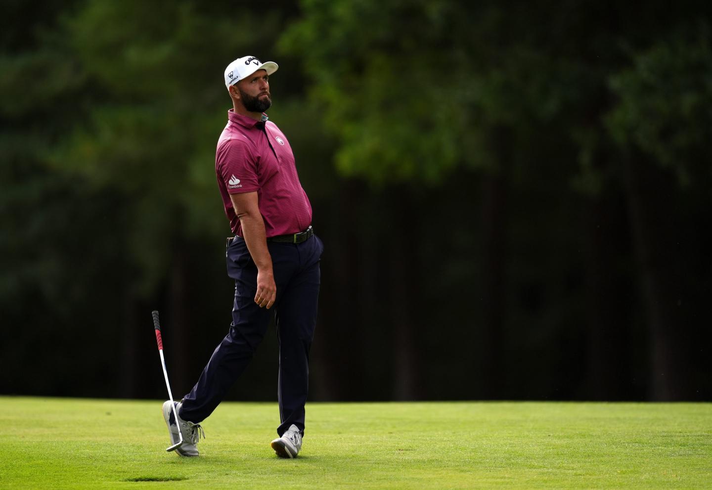 Jon Rahm of Spain drops his club on the 13th hole during the first round of the BMW Championship golf tournament in Virginia Water, England.