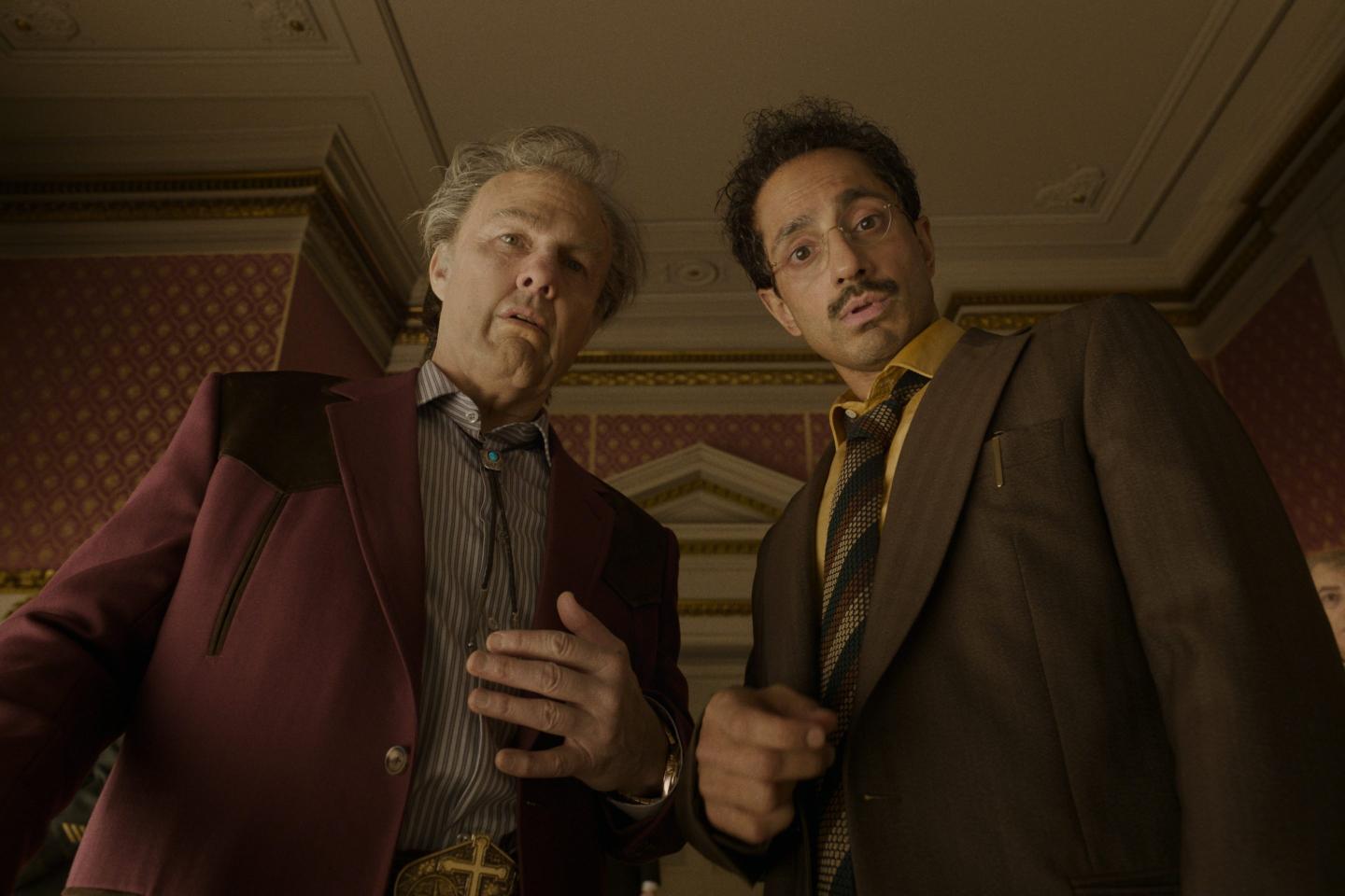 Tom Cruise, left, and Riz Ahmed in a scene from "Digger." 