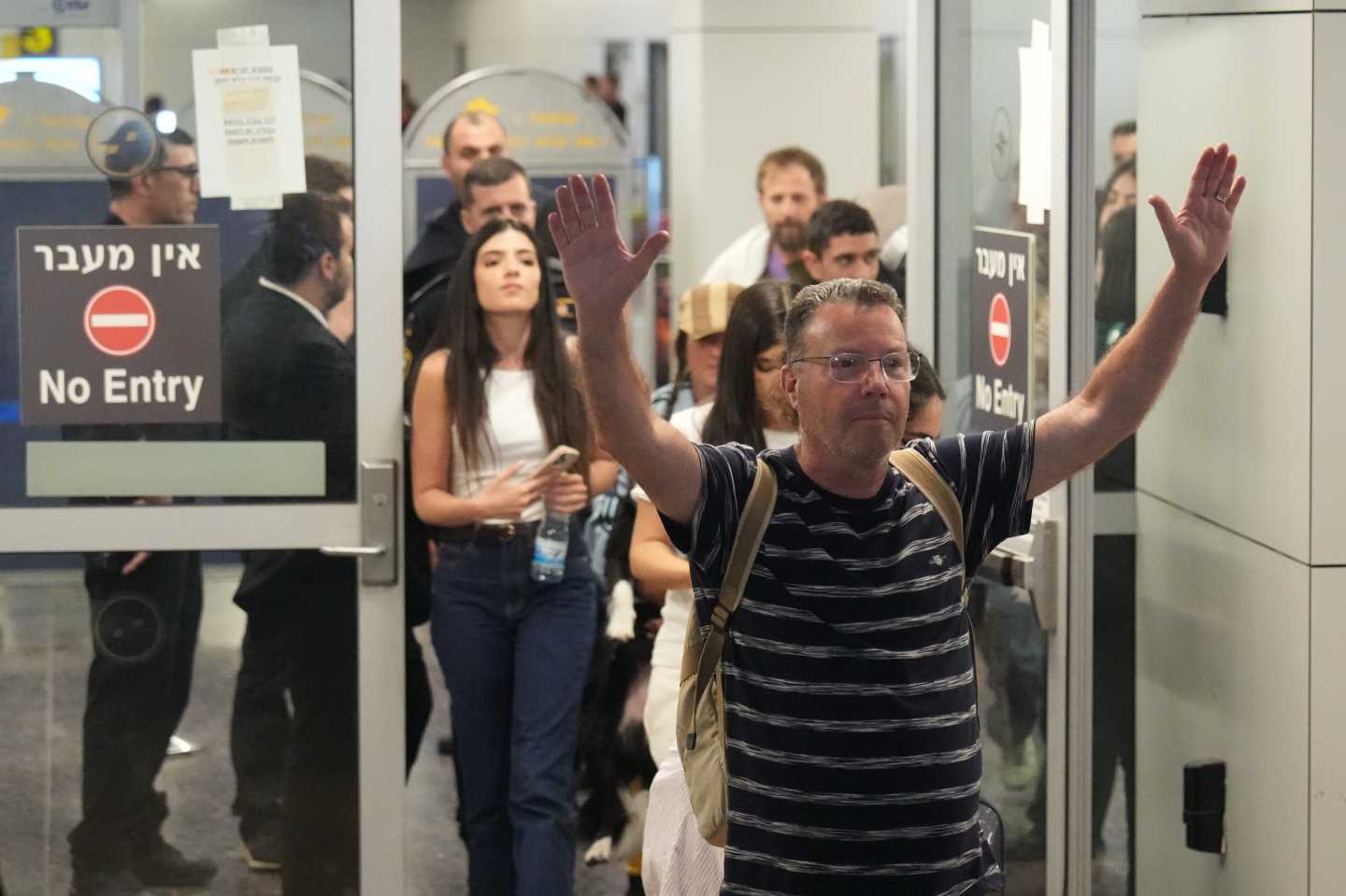 Israeli passenger Haim Lazarovich, who experienced an emergency landing in Saudi Arabia, during a flight on FlyDubai plane, arrives at Ben Gurion International Airport, near Tel Aviv, Israel.