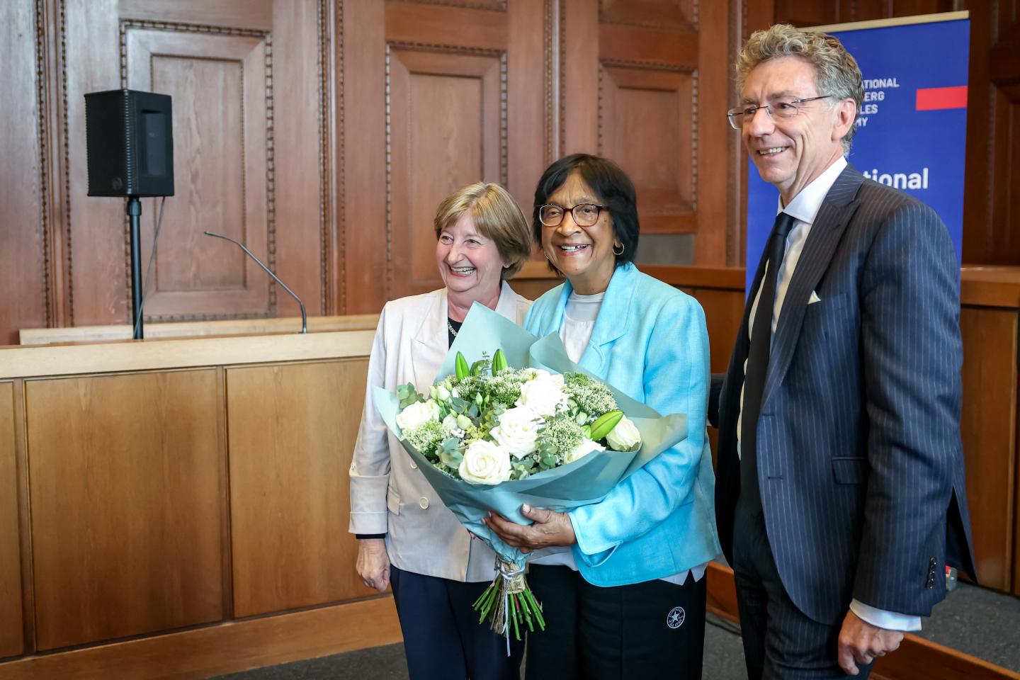 South African-born jurist and former U.N. human rights chief Navanethem "Navi" Pillay, center, poses with the former president of the International Criminal Court (ICC), Silvia Fernández de Gurmendi, and the director of the International Academy of the Nuremberg Principles, Christoph Safferling, at the Nuremberg Forum in Nuremberg, Germany, Friday, Oct. 9, 2026.