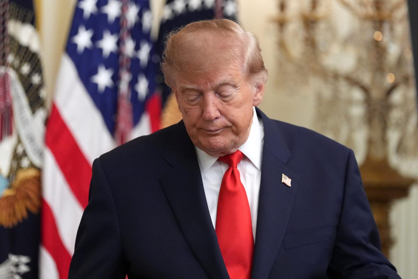 President Donald Trump walks after speaking at a Columbus Day celebration in the East Room of the White House, Friday, Oct. 9, 2026.