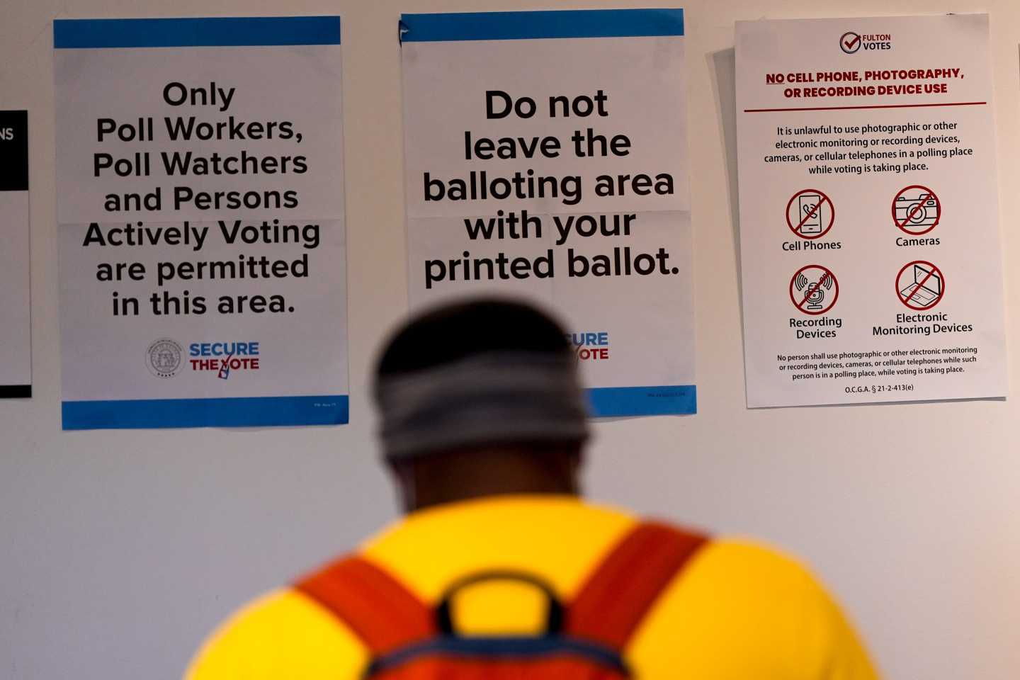 A man walks inside the The High Museum of Art voting center on the first day for early voting in Georgia, Tuesday, Oct. 13, 2026, in Atlanta.