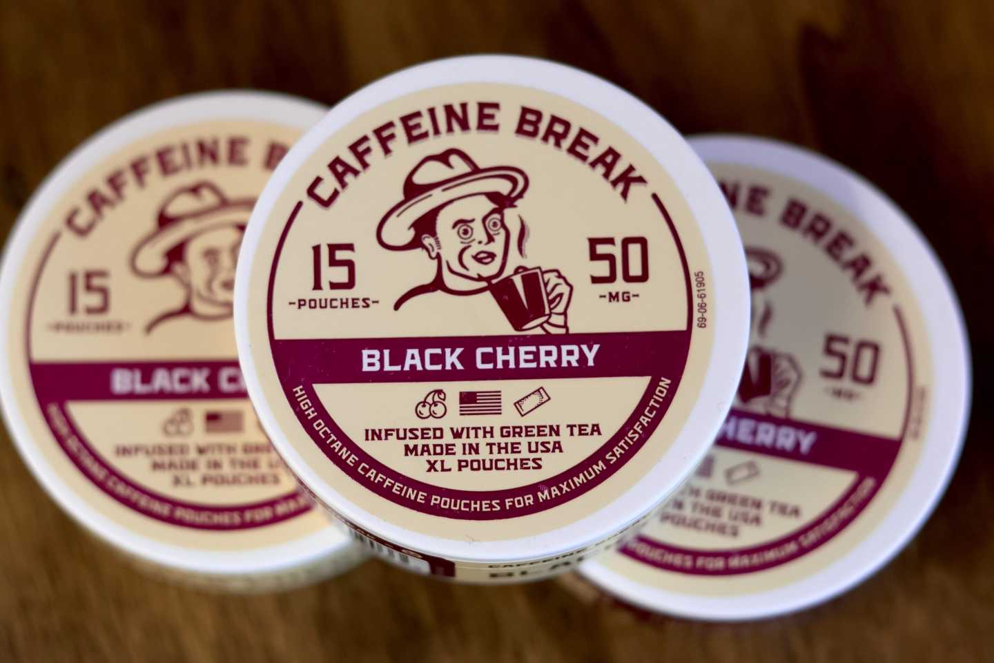 Containers of caffeine pouches, small packets placed in the mouth between the lip and gum, are on display at Red Star Vapor Smoke in Flagstaff, Ariz.