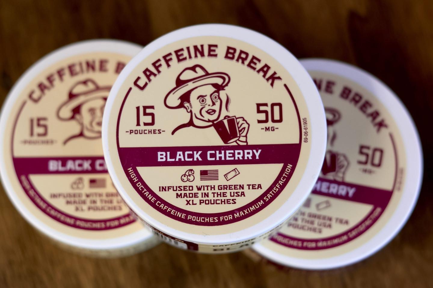 Containers of caffeine pouches, small packets placed in the mouth between the lip and gum, are on display at Red Star Vapor Smoke in Flagstaff, Ariz.