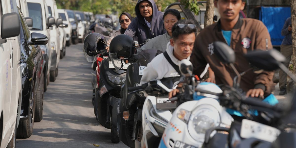 ‘This is really a waste of time’: Bali drivers queue for hours for fuel as Indonesia blames a tanker delay, bad weather and panic-buying