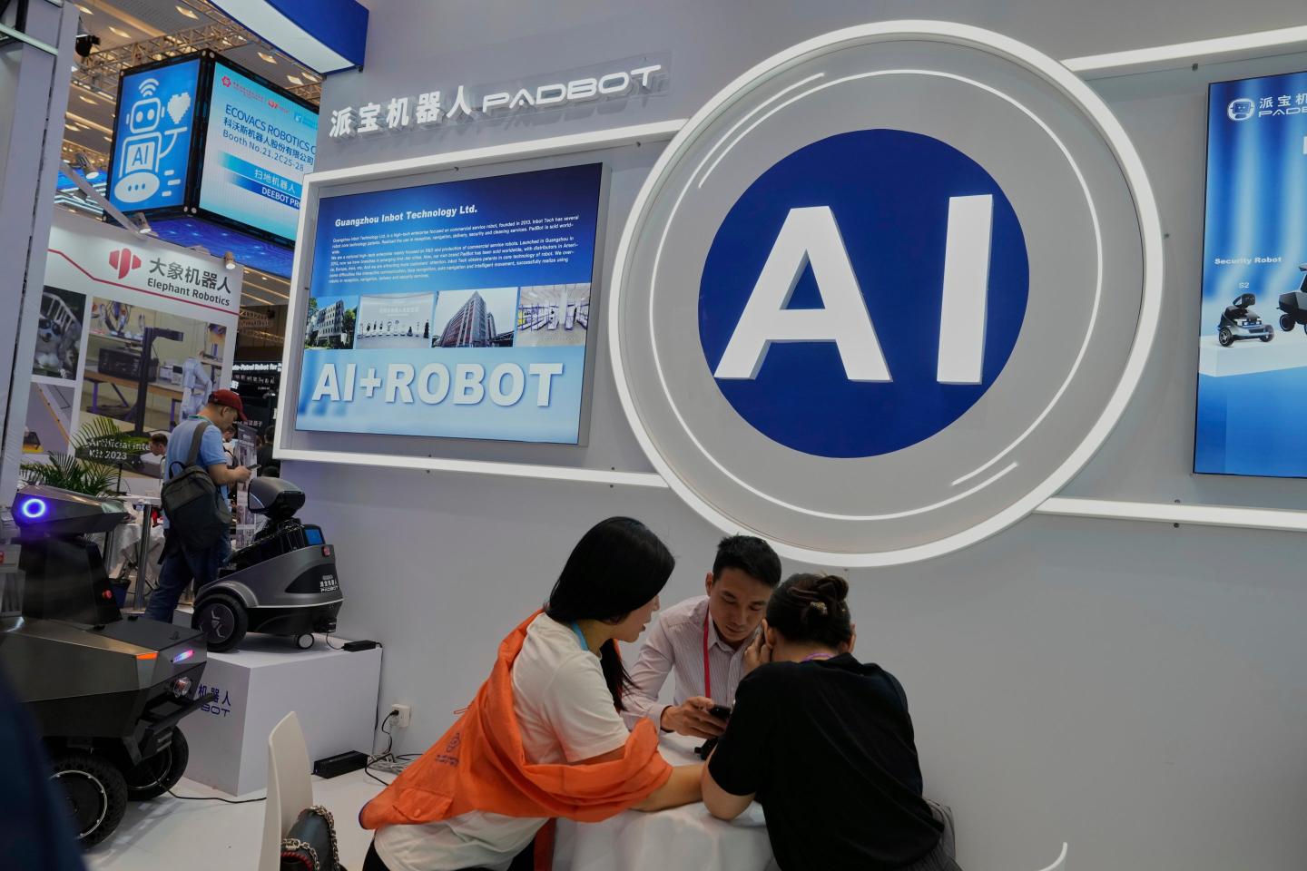 Vendors for AI enabled robots wait for customers at the 137th Canton Fair in Guangzhou in southern China's Guangdong province.