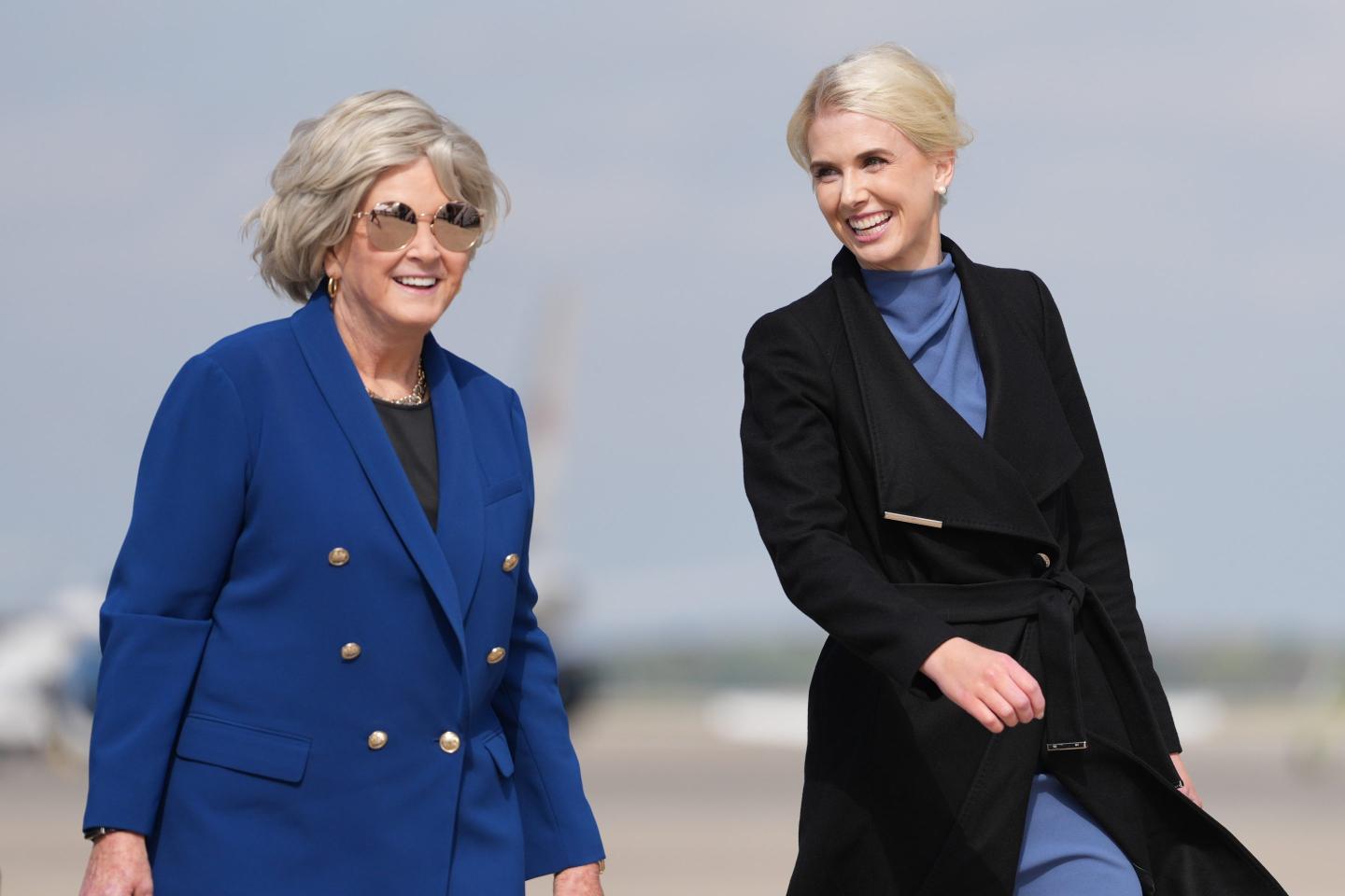 White House chief of staff Susie Wiles and White House aide Natalie Harp walk to board Air Force One, Friday, Oct. 16, 2026, at Joint Base Andrews, Md.