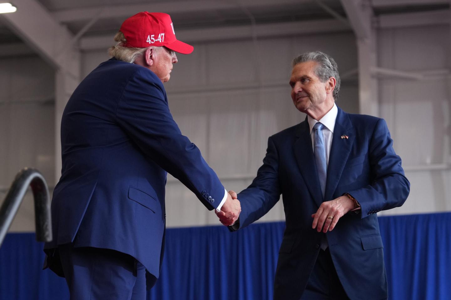 President Donald Trump shakes hands with Georgia gubernatorial candidate Rick Jackson at a campaign rally at Dalton Municipal Airport, Friday, Oct. 16, 2026, in Dalton Ga.