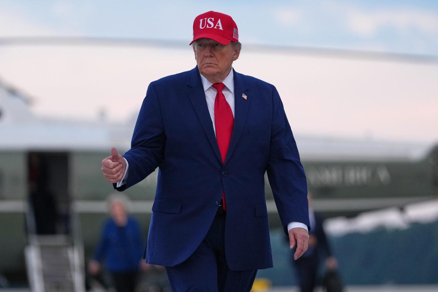 President Donald Trump walks from Marine One to board Air Force One, Friday, Oct. 16, 2026, at Dobbins Air Reserve Base, Ga.