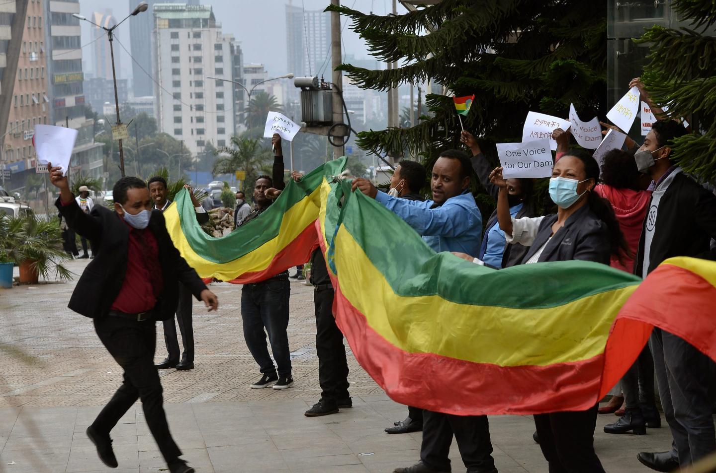 In this Sunday, Aug. 2, 2020 file photo, Ethiopians celebrate the progress made on the Nile dam, in Addis Ababa, Ethiopia.