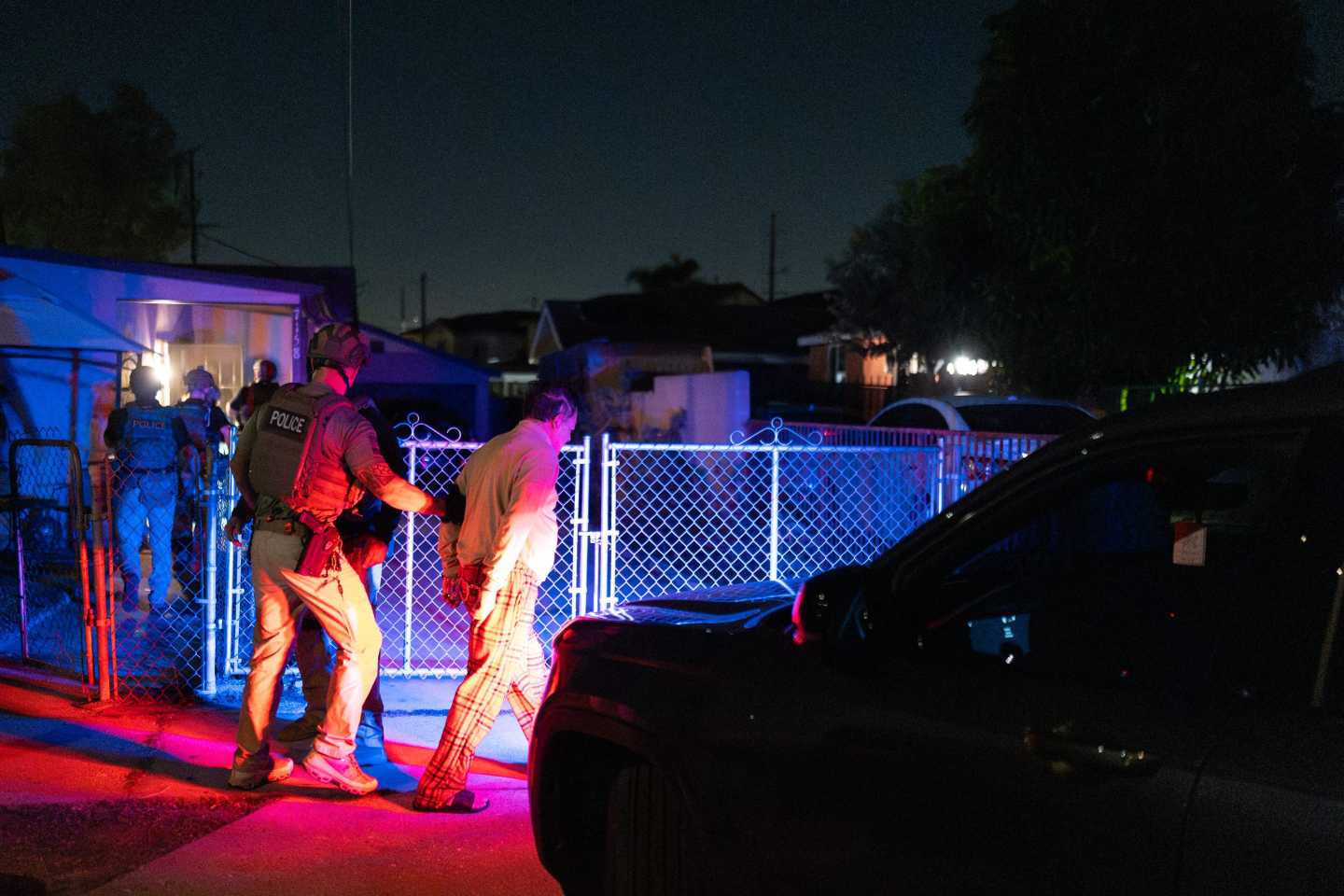 Homeland Security Investigations task force officers arrest a suspect accused of illegally registering to vote during a federal operation in Commerce.