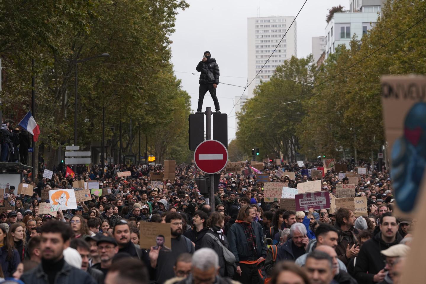 Protesters march during a demonstration against rising living costs in Paris.