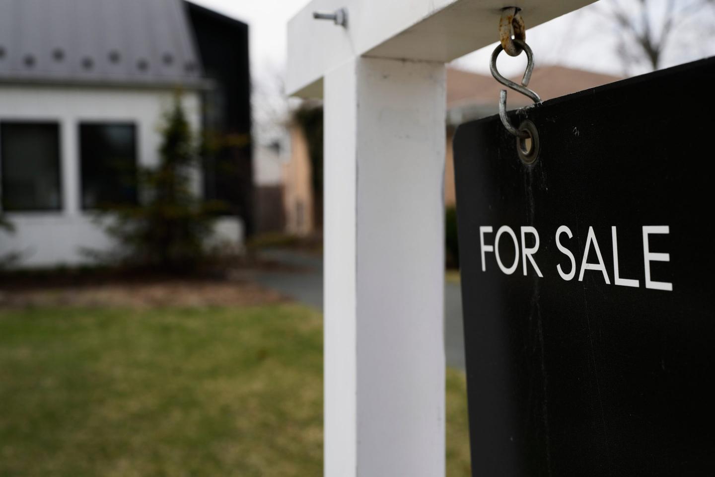 A House For Sale sign is displayed in front of a home in Evanston, Ill., Wednesday, March 25, 2026.
