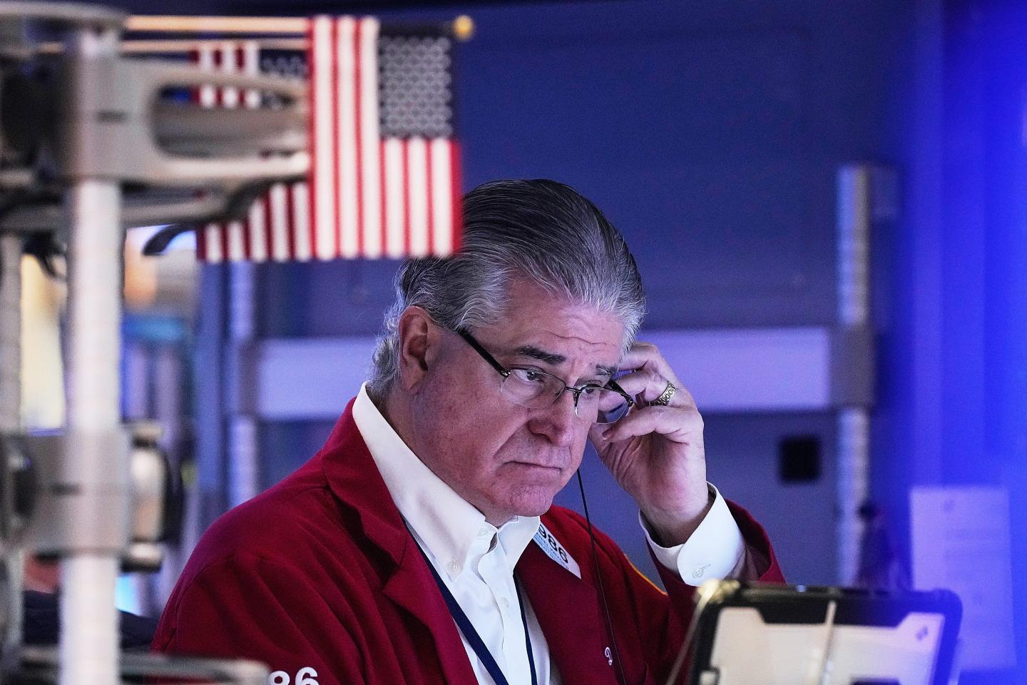 Trader Daniel Kryger works on the floor of the New York Stock Exchange.