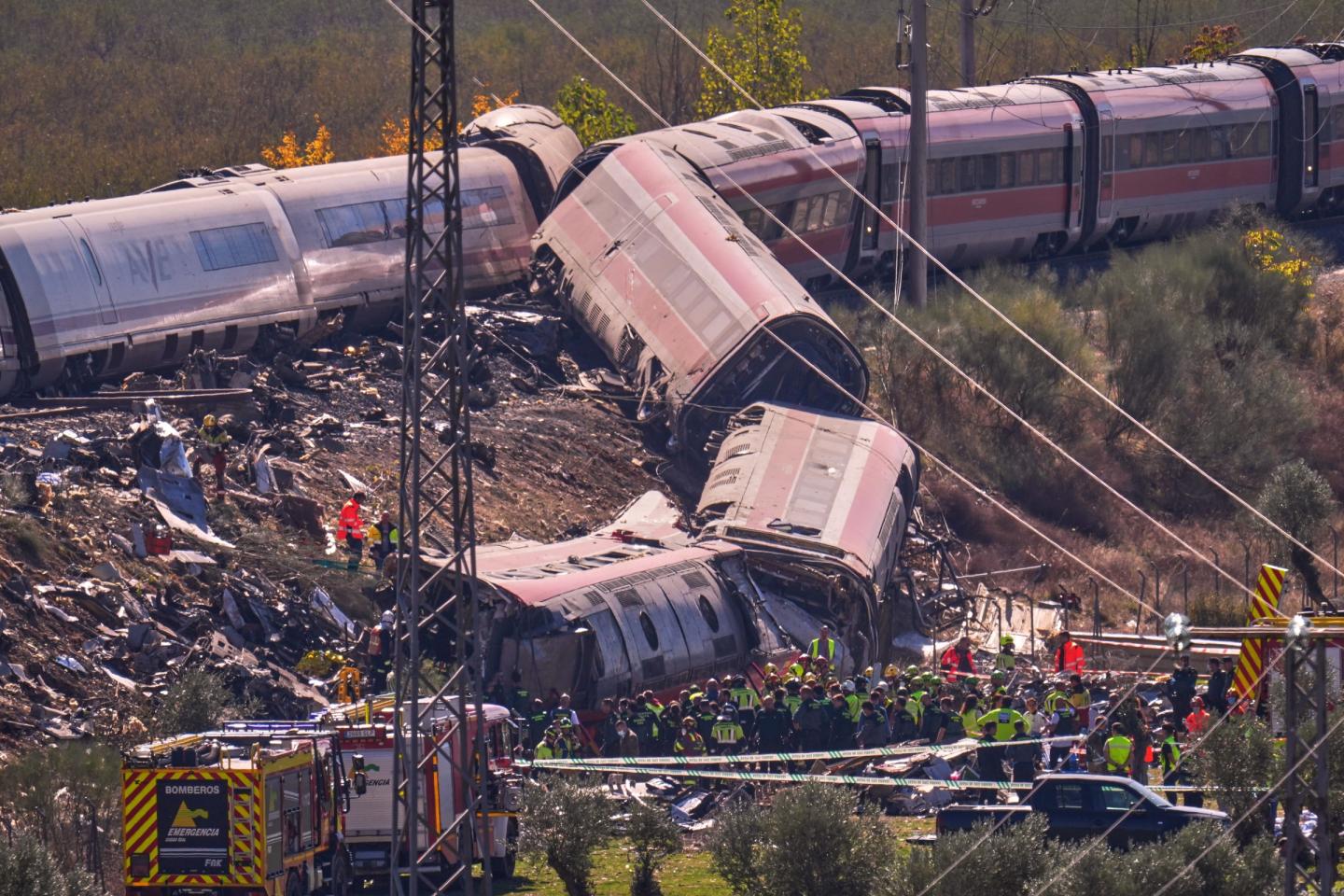 Emergency services work at the scene of a collision between two trains in Urda, Spain