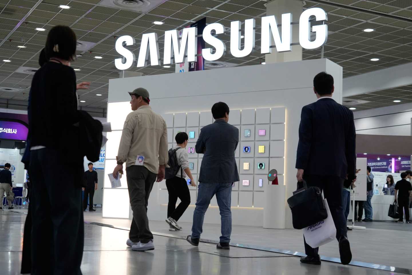 Visitors pass by the Samsung Electronics' booth during the Korea Electronics Show 2026 in Seoul, South Korea.