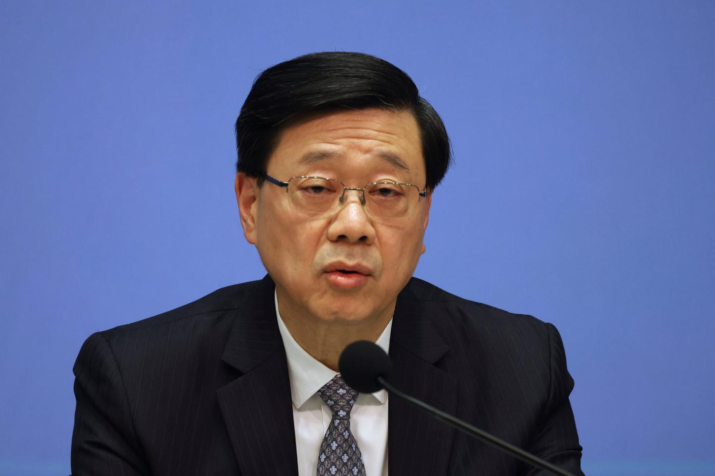Hong Kong Chief Executive John Lee speaks during a press conference on the Wang Fuk Court fire inquiry report in Hong Kong.