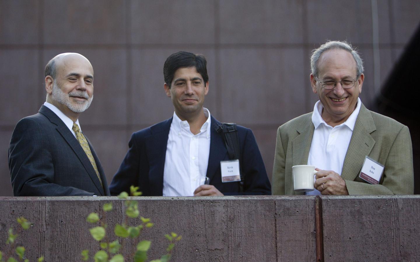 Ben S. Bernanke, chairman of the U.S. Federal Reserve, left, Kevin Warsh, governor of the U.S. Federal Reserve, center, and Donald Kohn, vice chairman of the U.S. Federal Reserve, talk outside the Jackson Lake Lodge before the opening session of the Federal Reserve Bank of Kansas City annual symposium near Jackson Hole, Wyoming, U.S., on Friday, Aug. 27, 2010.