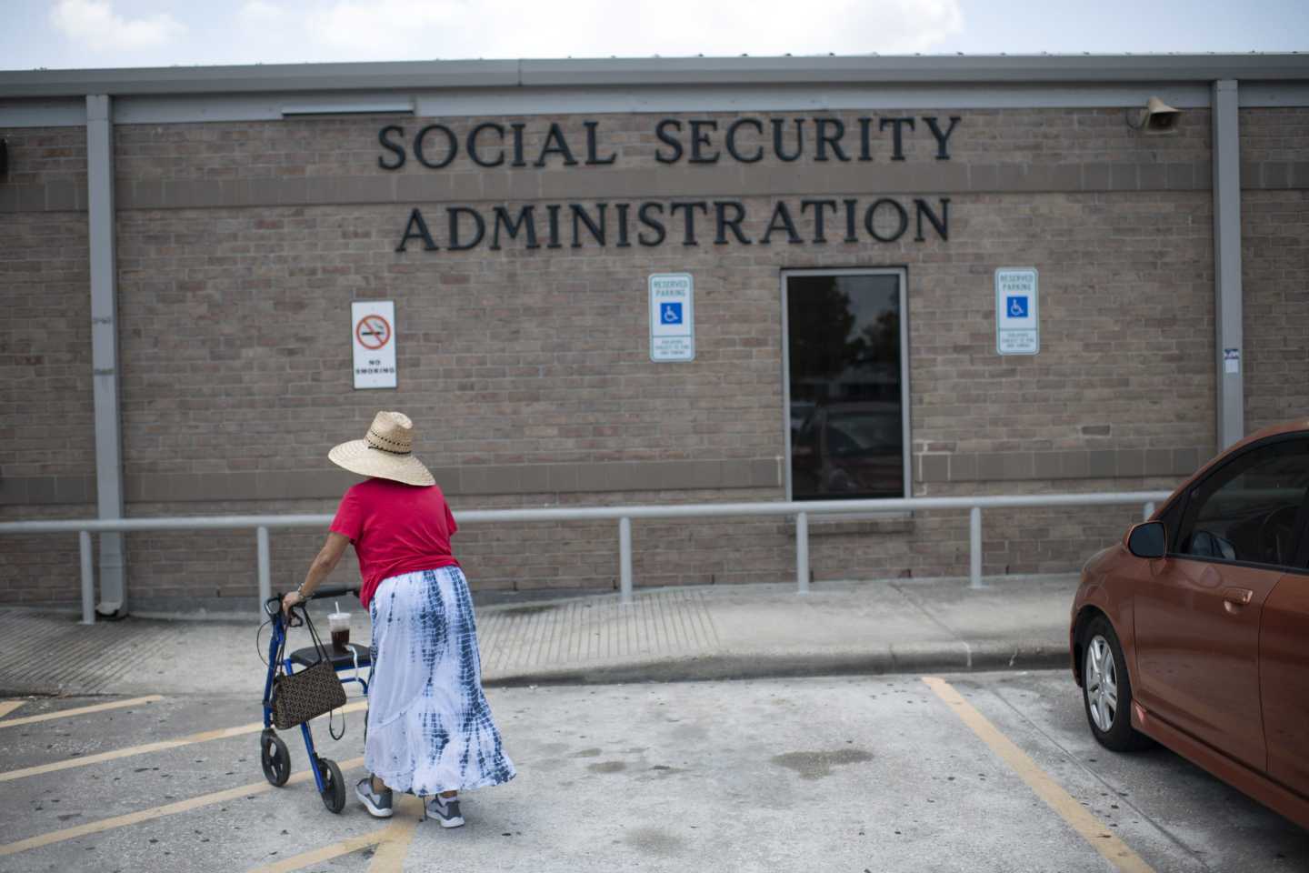 A woman walks into a Social Security office in Houston, Texas on July 13, 2022.