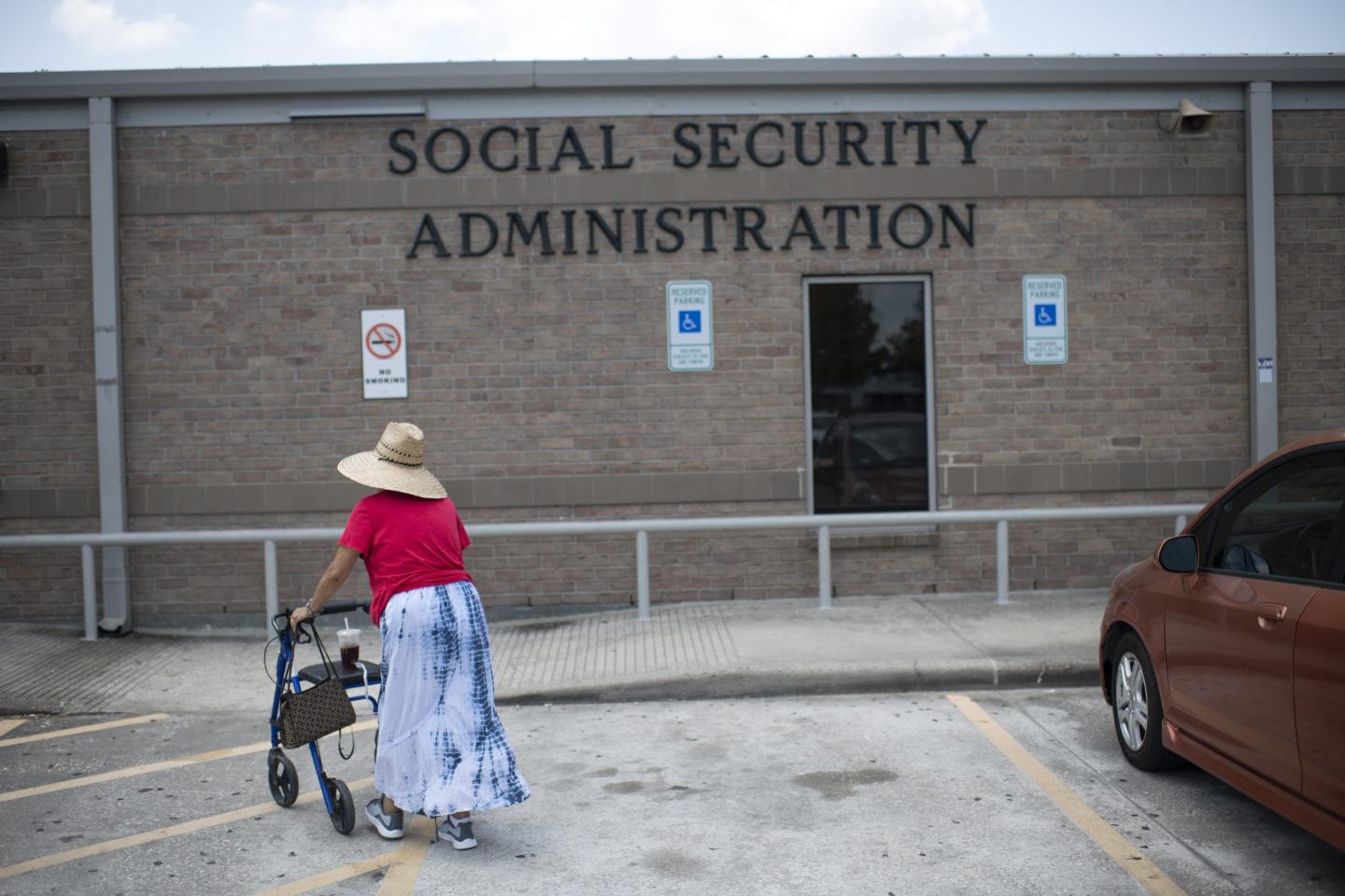 A woman walks into a Social Security office in Houston, Texas on July 13, 2022.