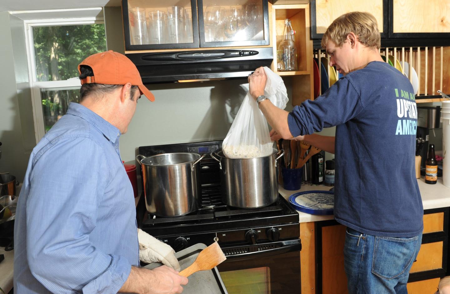 Craig Gravina of the Albany Ale Project, left, and Jimmy Vielkind make a home brew batch of Albany Ale at Vielkind's home on Friday, Sept. 20, 2013 in Delmar, N.Y.