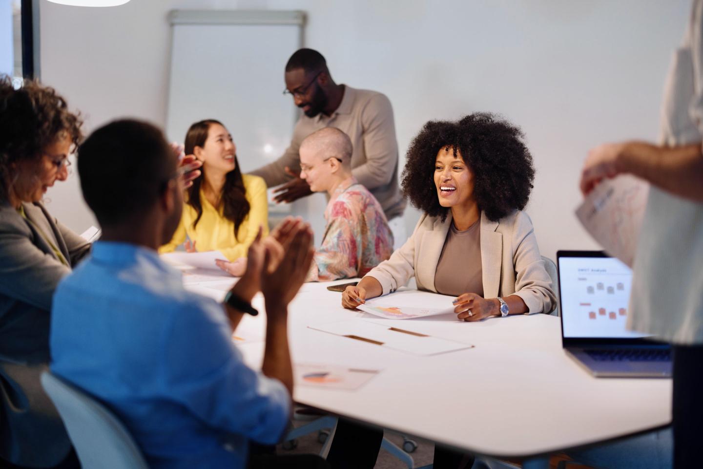 Close-up of people attending a collaboration session in the office