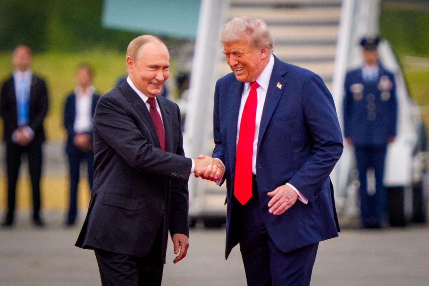 President Donald Trump greets Russian President Vladimir Putin as he arrives at Joint Base Elmendorf-Richardson on August 15, 2025 in Anchorage, Alaska.