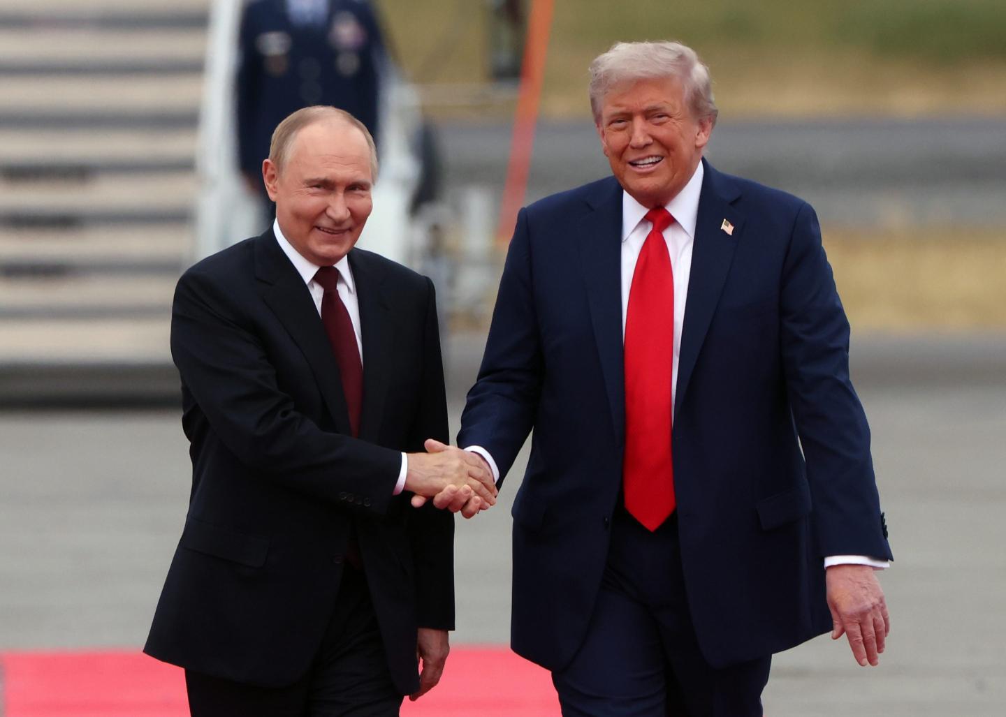 President Donald Trump welcomes Russian President Vladimir Putin to Joint Base Elmendorf-Richardson on August 15, 2025 in Anchorage, Alaska. 