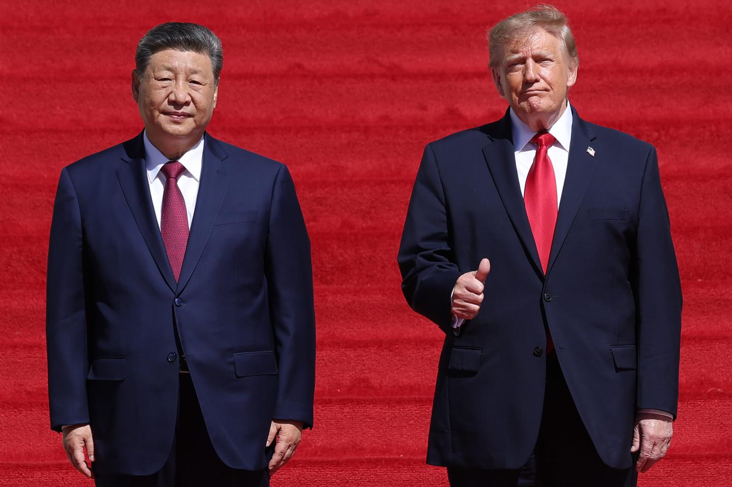 U.S. President Donald Trump (R) and President of China Xi Jinping (L) arrive for a tour of the National Archives Museum.