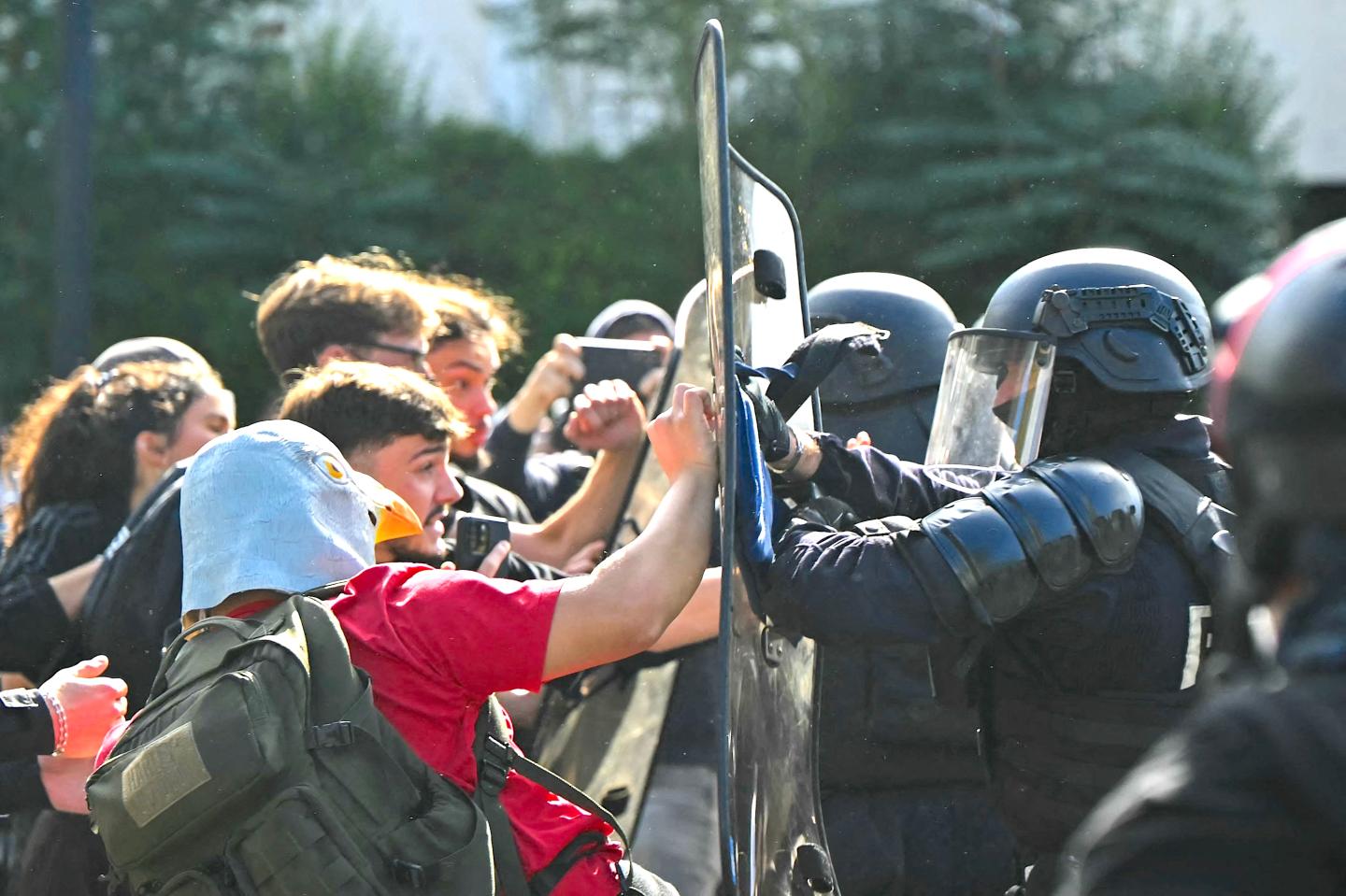 Photo: Protesters in France confront police.