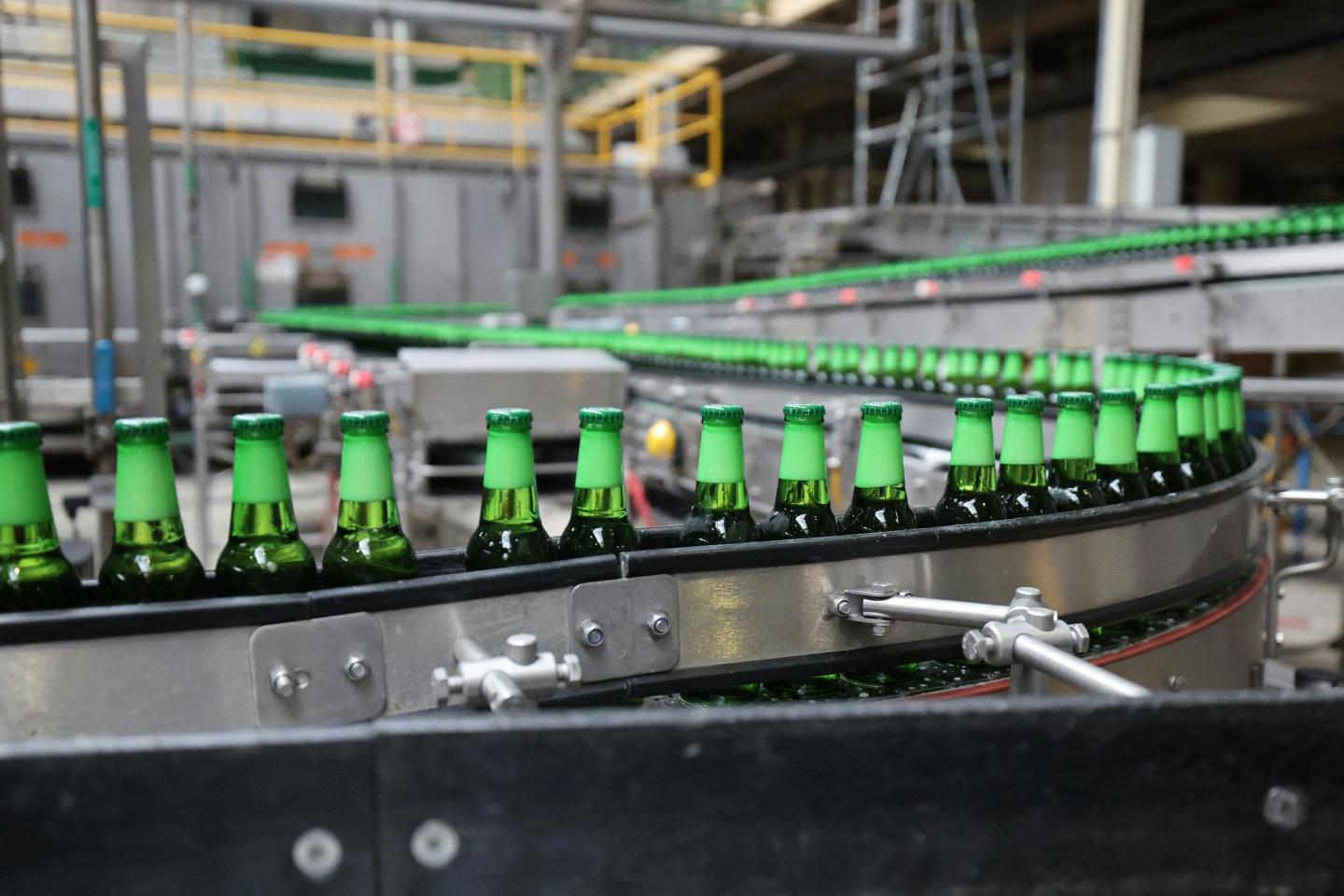 Bottles in a filling line at Heineken's factory in Mons-en-Barul, northern France on September 1, 2026.