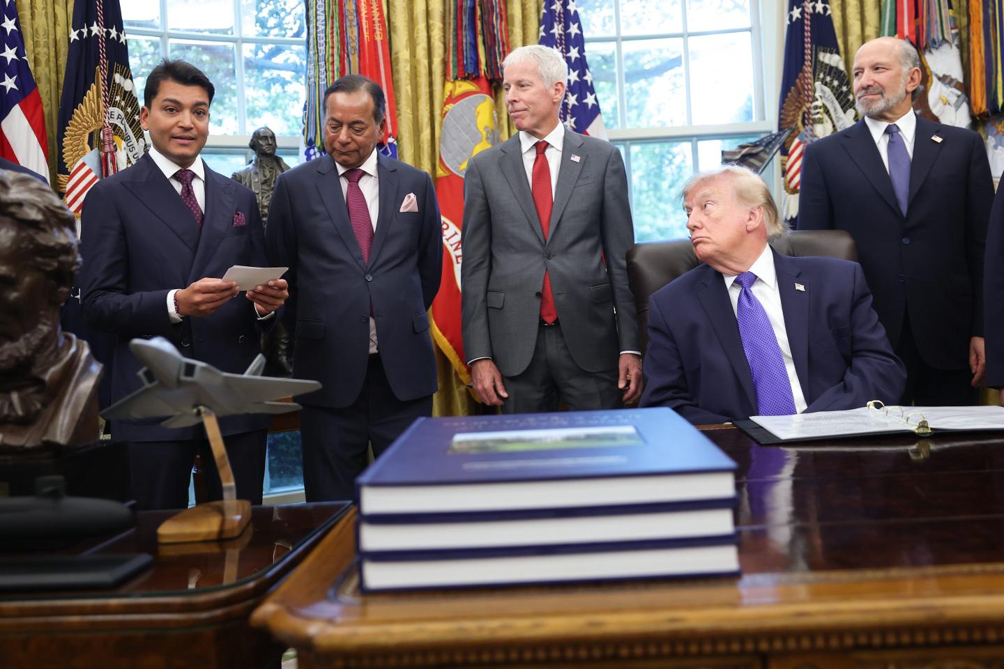 U.S. President Donald Trump speaks with Rewant Ruia (L), Chairman of Mesabi Metallics, and Ravi Ruia (2nd L), Board Member of Mesabi Metallics and Director of Essar Capital, while making an announcement in the Oval Office at the White House on September 28, 2026 in Washington, DC. Trump announced plans that a new $15 billion steel plant will be built in eastern Iowa by Mesabi Metallics and is projected to be one of the largest in the United States.