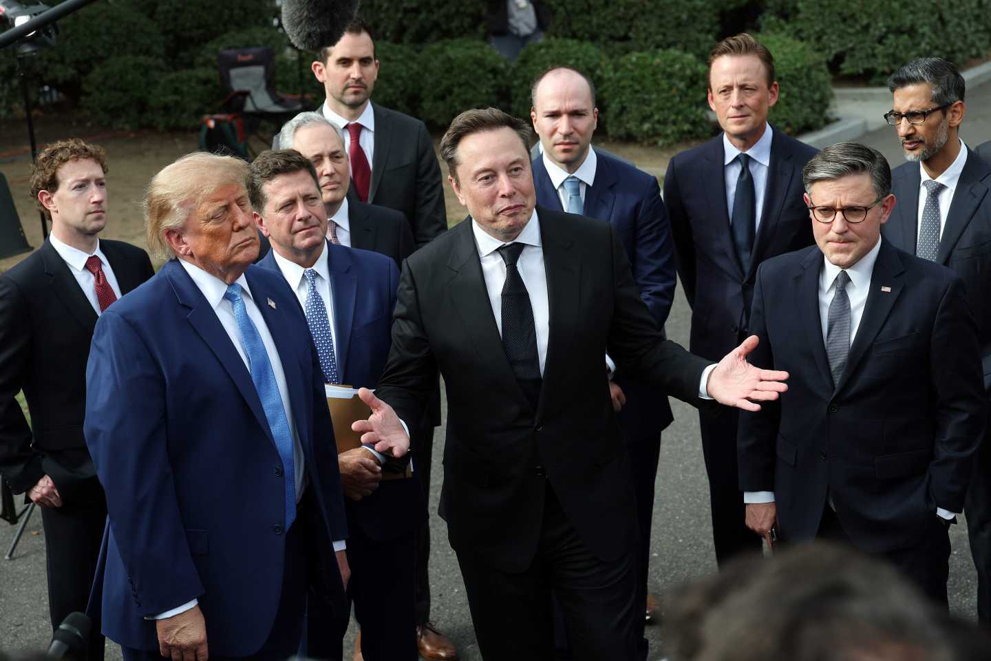 Trump stands with tech CEOs.