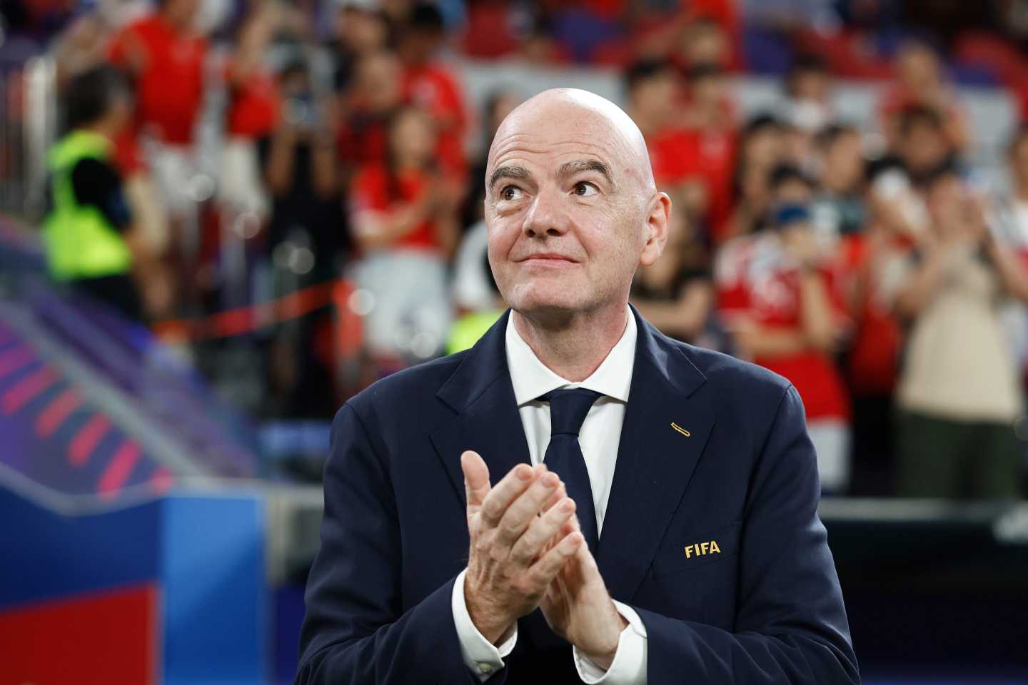 Gianni Infantino, President of FIFA, applauds following the FIFA ASEAN CUP Division 2 final between Hong Kong and Cambodia at Kai Tak Stadium.