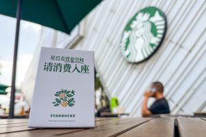 Starbucks China tells customers to buy something before they sit down, as it invests $45 million in the store experience