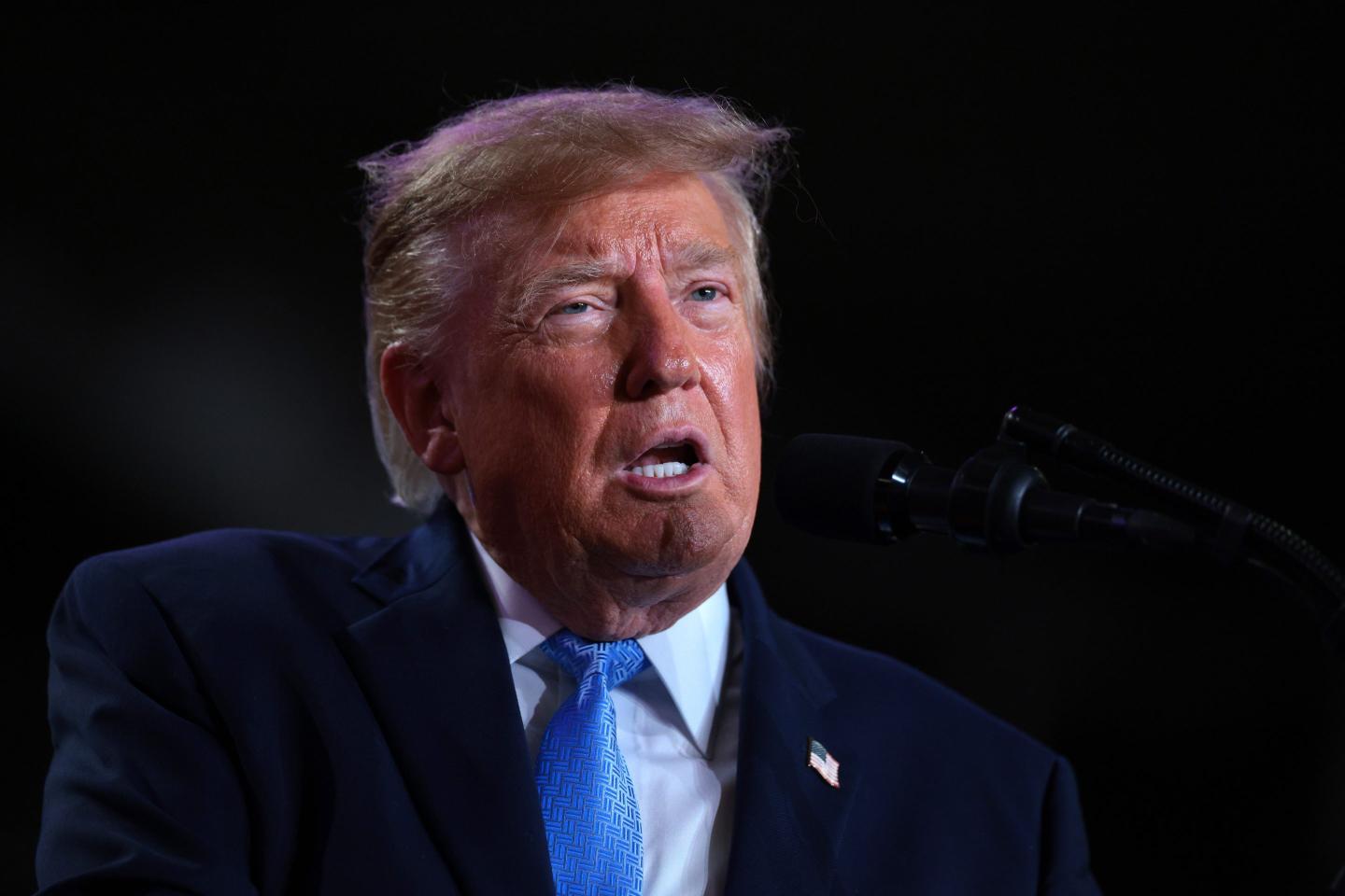 U.S. President Donald Trump delivers remarks during a campaign rally at Crossroads Arena.